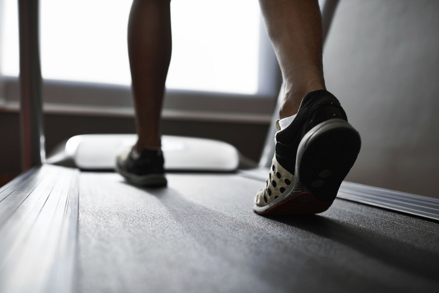 Image of a man walking on a treadmill