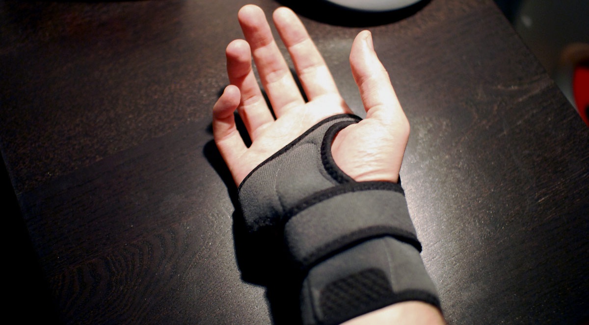 Image of a man wearing a carpal tunnel wrist brace