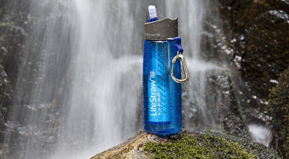 Image of a filtered water bottle sitting on a rock