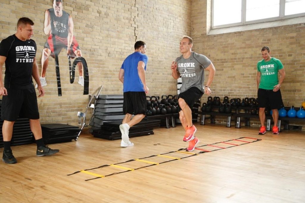 Chris Gronkowski warming up with rope ladder